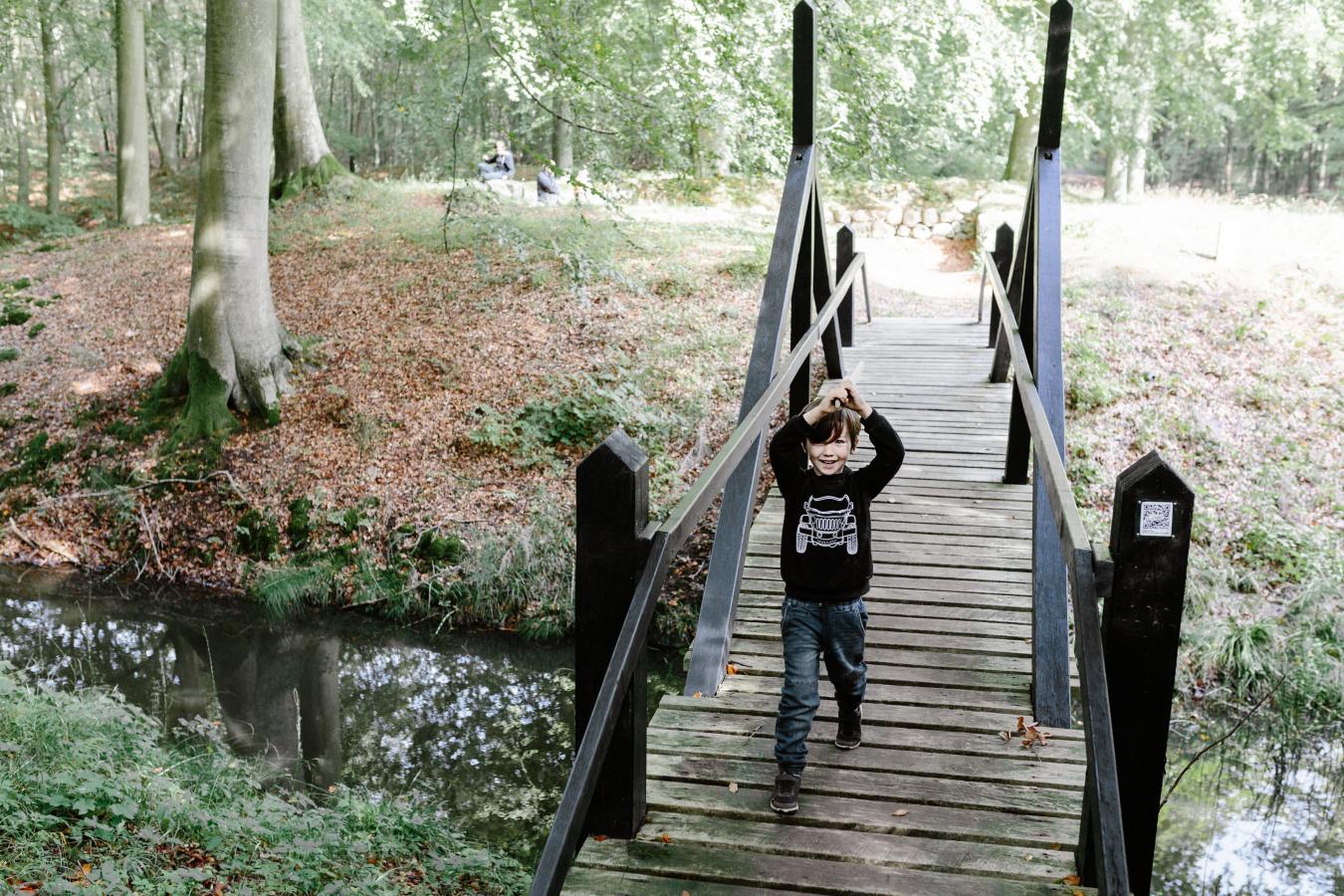 Boy playing pirates at the Stagsevold castle ruin in Staksrode Forest