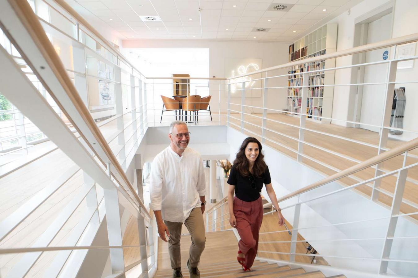 Two guests walking up the stairs at Horsens Art Museum