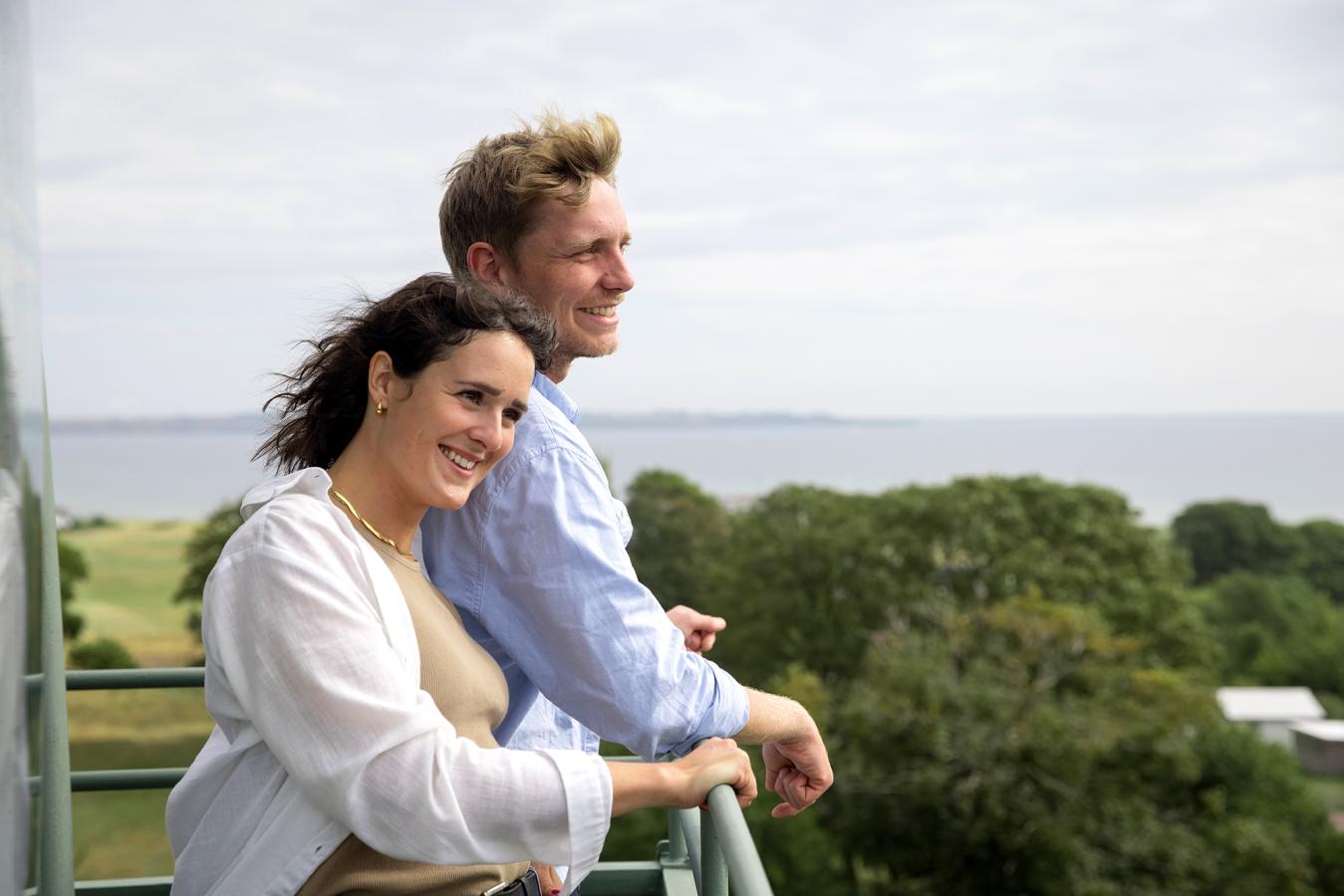 A couple looking out from the church and lighthouse at Tunø Church in Destination Coastal Land