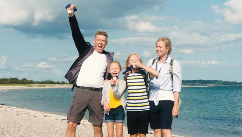 Family cheering after having completed the Tunoe Treasure Hunt