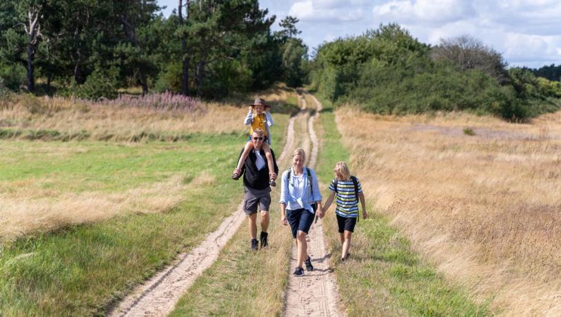 Family walking around Tunø attending The  Tunø Treasure Hunt