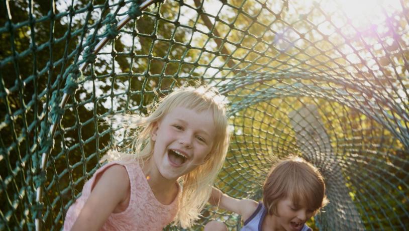 Kids plays in a rotating net
