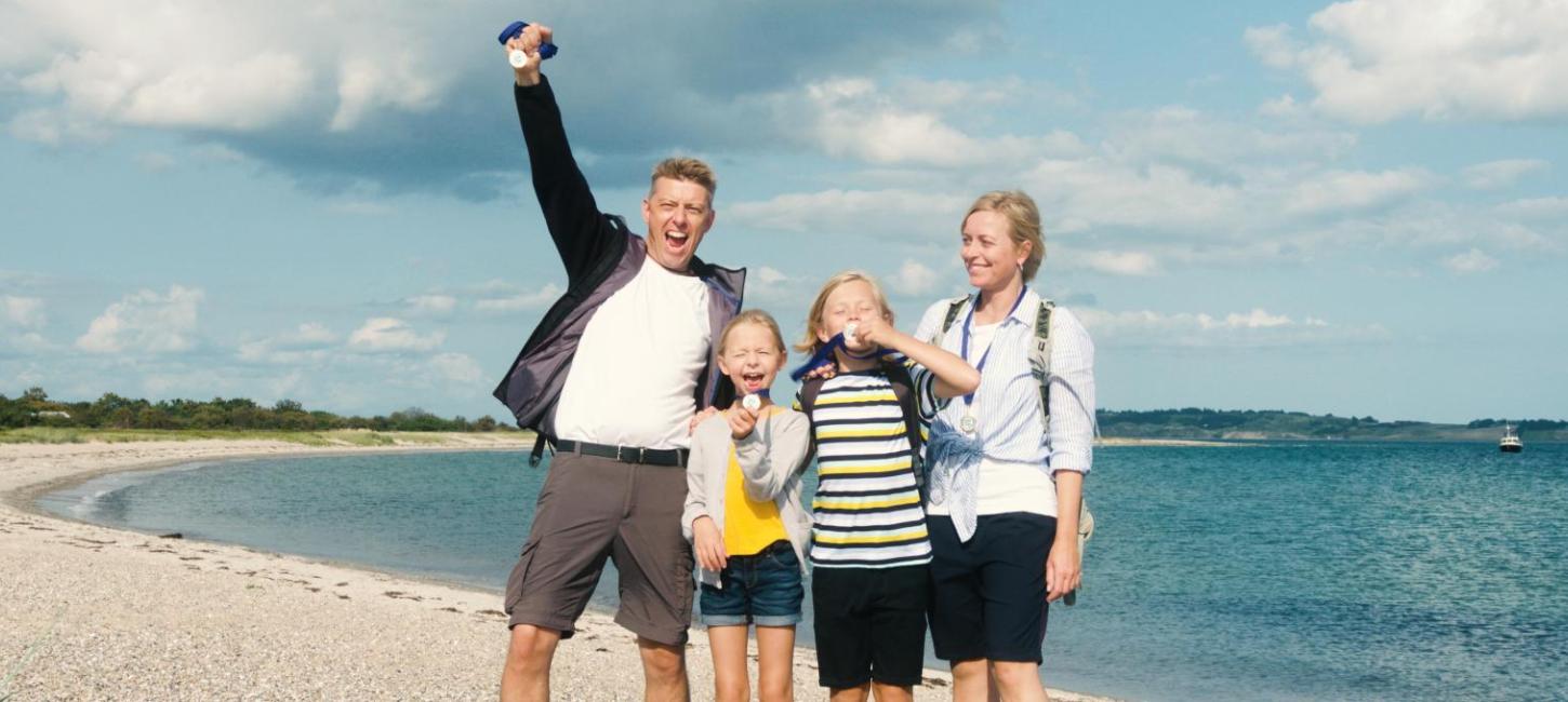 Family cheering after having completed the Tunoe Treasure Hunt