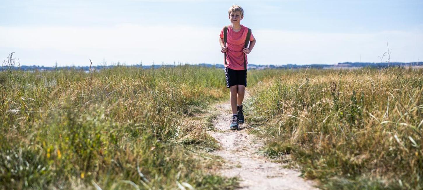 Boy walking on The Horsens-Odder Railway Path