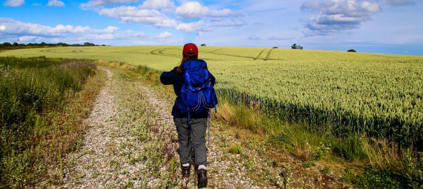 Backpacker walks on The Railway Path Odder-Horsens