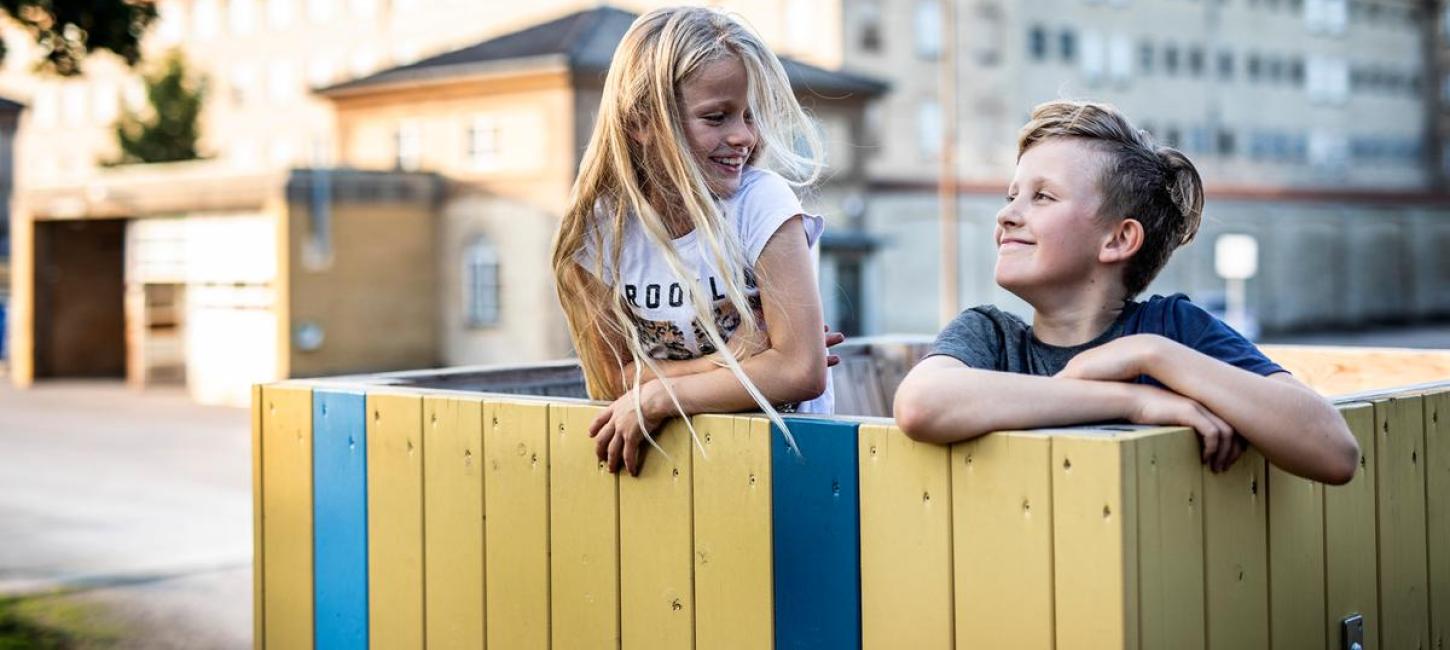 Siblings playing in a playground