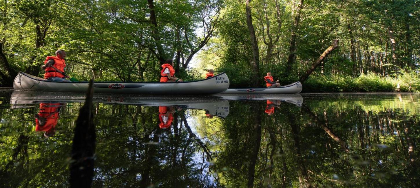 Family on a canoe trip at klostermølle