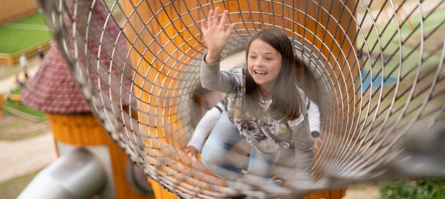 Girl in the play tower in Juelsminde Nature Play Park