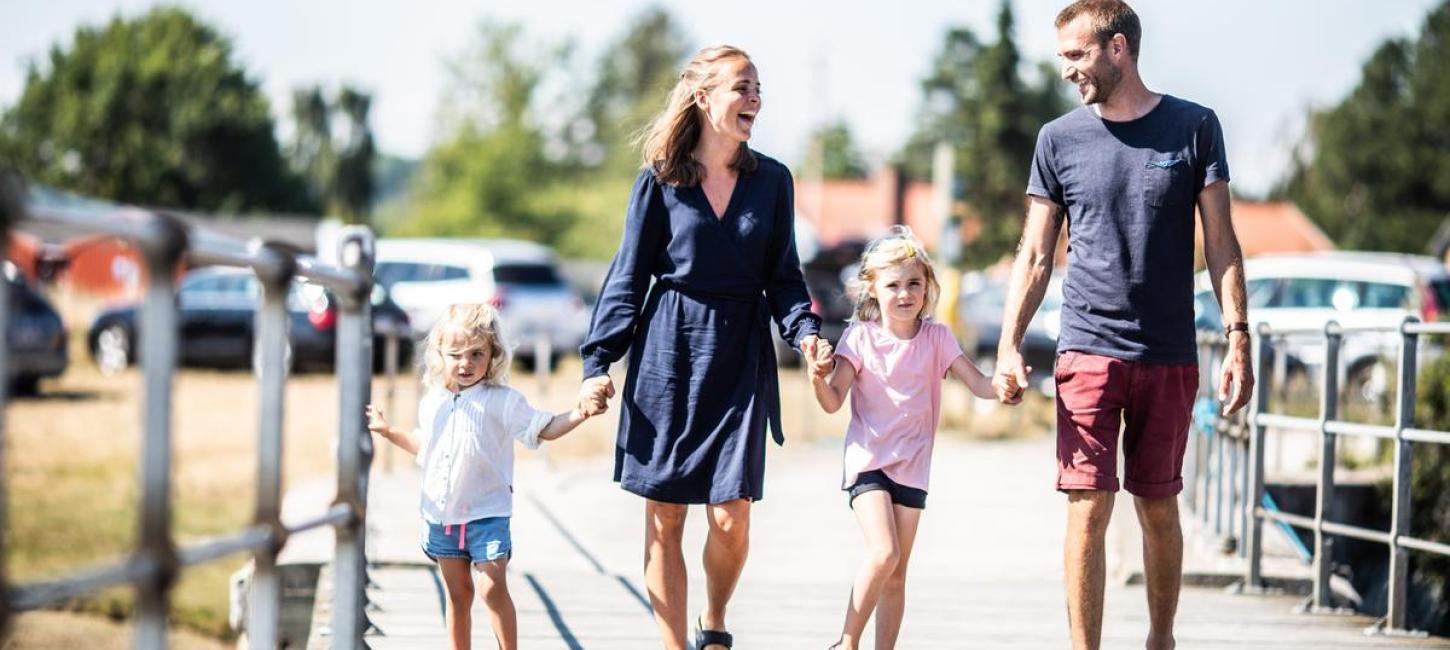 Family walking at Norsminde Marina