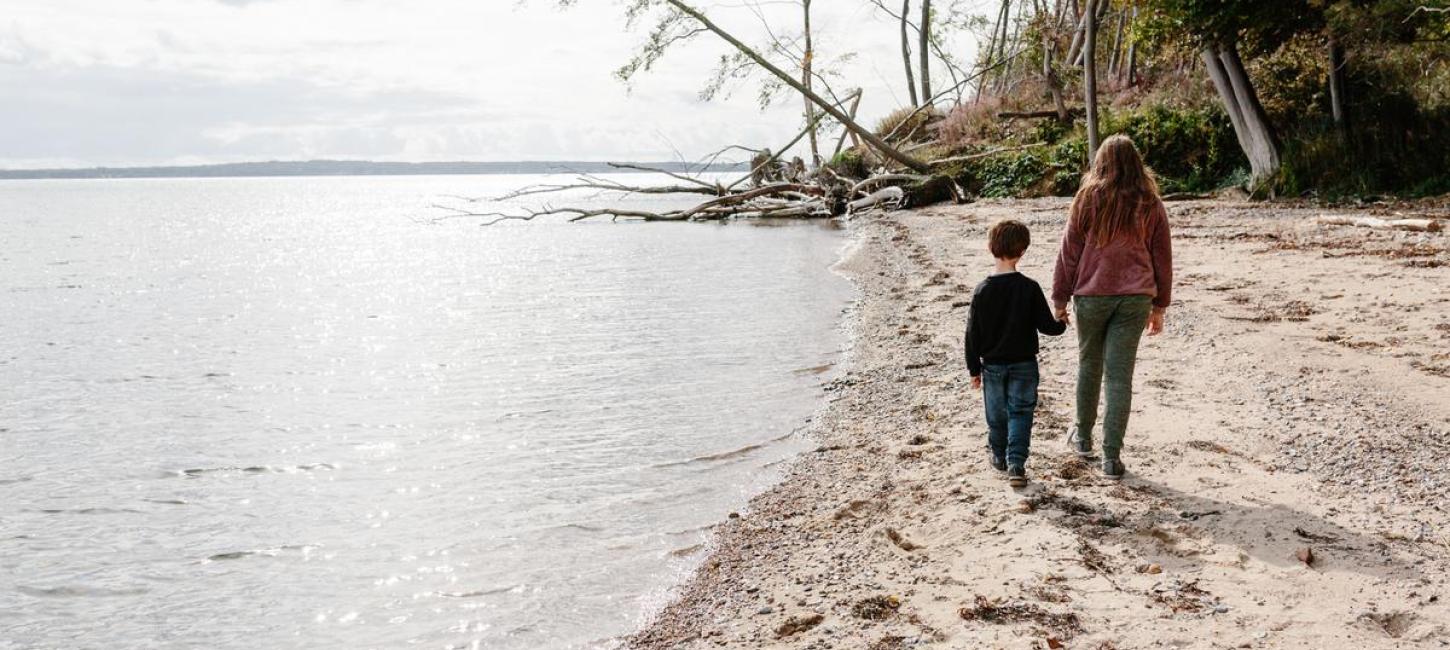 Children walking on Stenhøj Beach in the Coastal Land