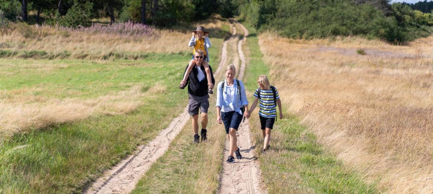 Family walking around Tunø attending The  Tunø Treasure Hunt