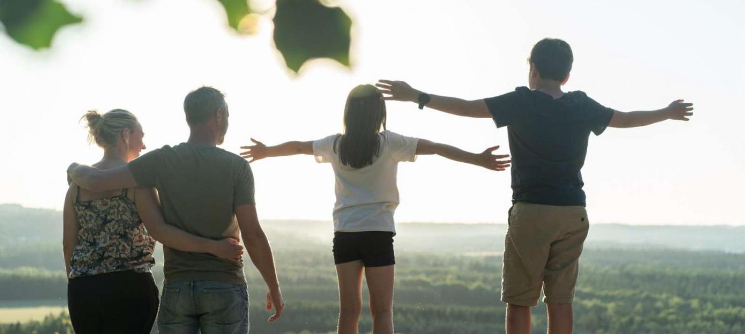 Family enjoying the view from the top of The Sugar Loaf in Destination Coastal Land