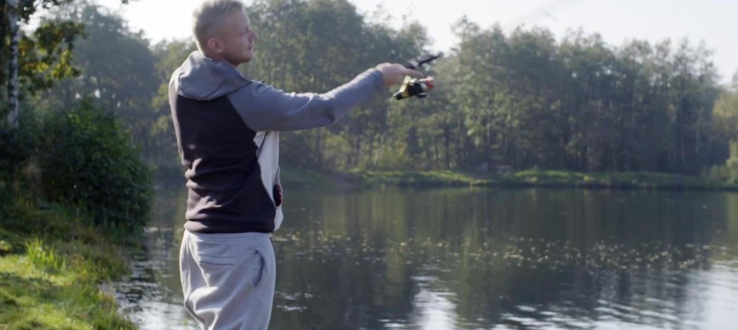 Man casting his fishing rod at Fyelmose Put & Take