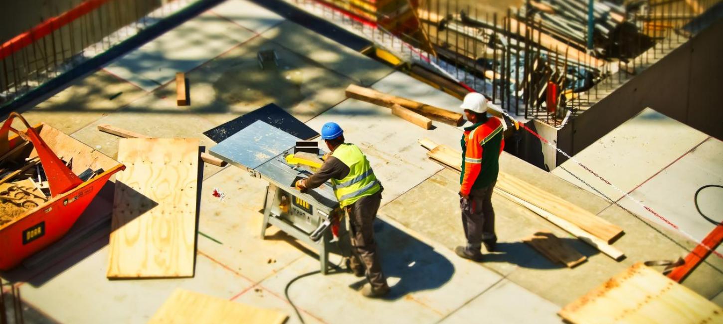 Two workers on a Construction site 