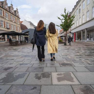 Two women walking along Søndergade in Horsens - part of Destination Coastal Land