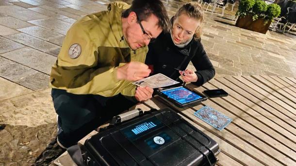 2 persons try the outdoor Escape Room in Horsens made by The Board Game Café in the Coastal Land
