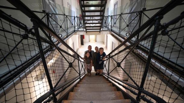 Family walks up on stairs