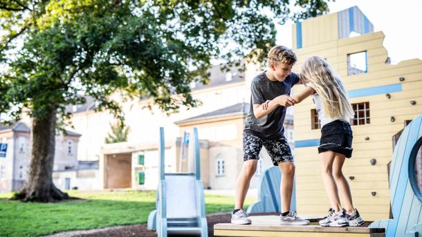 Children playing on a wobble board