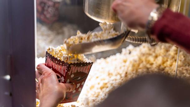 Cups with popcorn are filled at Biffen cinema in Odder which is located in Destination Coastal Land