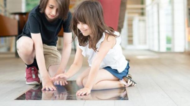 Two children playing with an interactive exhibition at the Horsens Art Museum