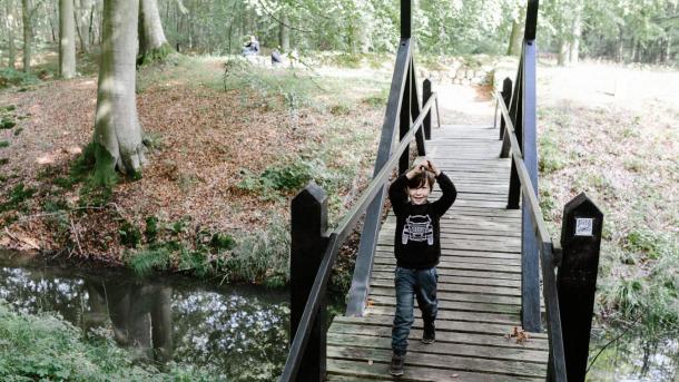 Boy playing pirates at the Stagsevold castle ruin in Staksrode Forest