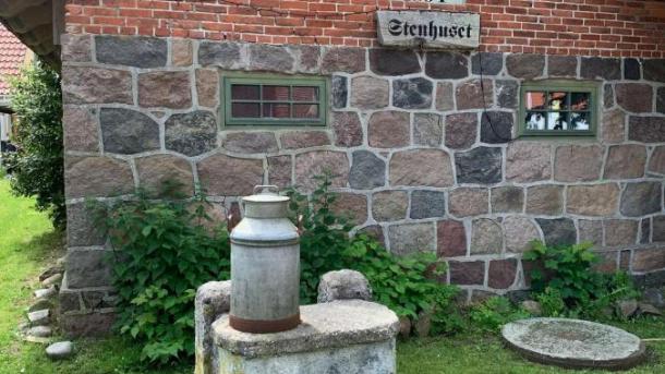 Milk table in front of Stenhuset on Tunø