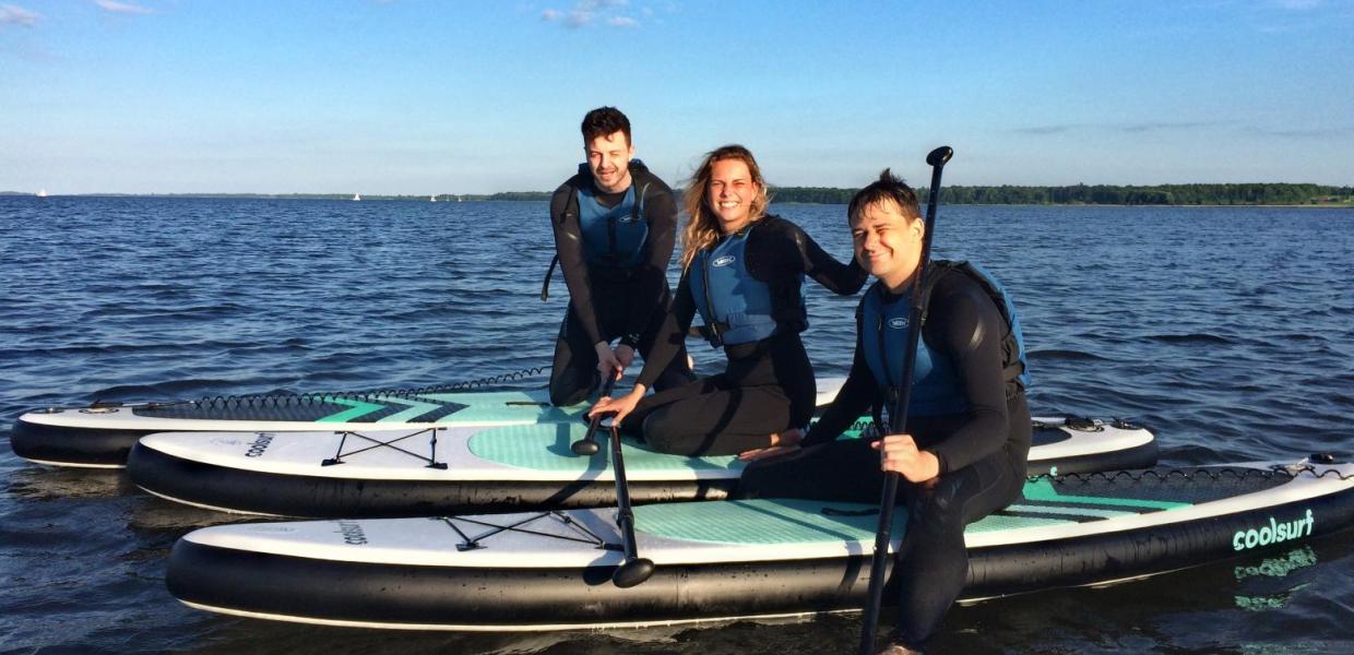 Three friends on SUP-boards in Horsens Fjord