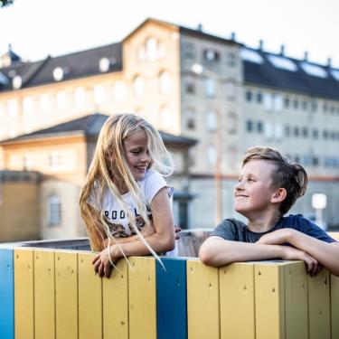 Siblings playing in a playground