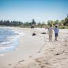 Children walking on Saksild Beach