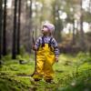 A child is standing in a forest in Sondrup