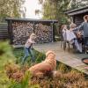 Family hanging out on the terrace of a holiday house from Feriepartner in the Coastal Land on the eastern coastline of the peninsula of Jutland in Denmark
