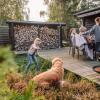 Family hanging out on the terrace of a holiday house from Feriepartner in the Coastal Land on the eastern coastline of the peninsula of Jutland in Denmark