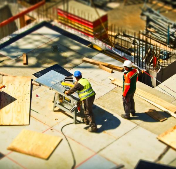 Two workers on a Construction site 