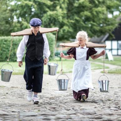 Kids dress up at the village history and open-air Glud museum in the costal land