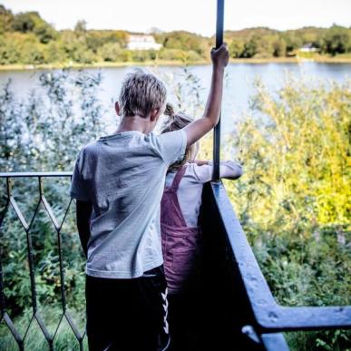Children looking at a pond