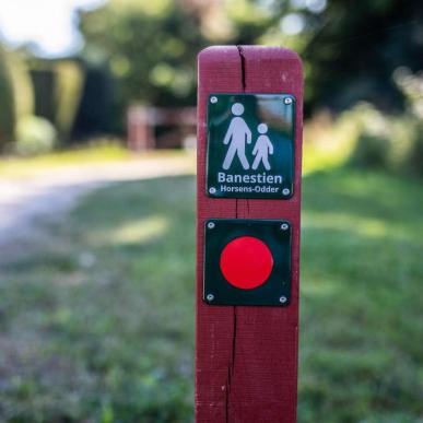 Pole with a sign on the Horsens-Odder Railway Path route