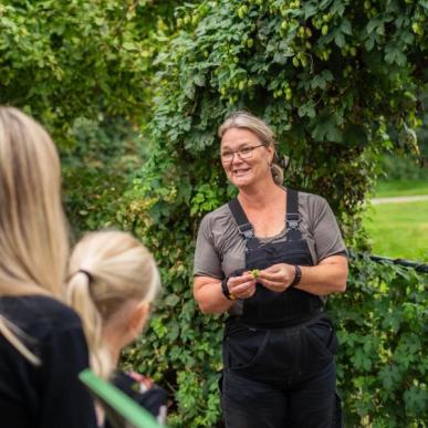 A local guide giving a tour of Endelave Medical Herb Garden on the year’s island of Endelave