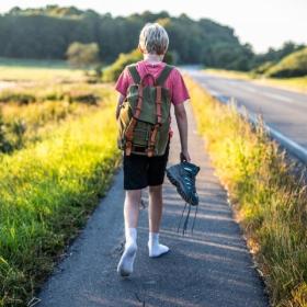 Boy walks on The Railway Path Horsens-Odder with out shoes