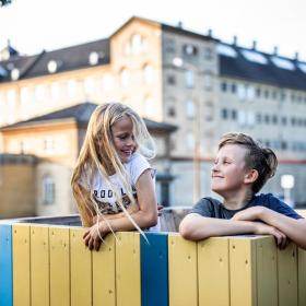 Siblings playing in a playground