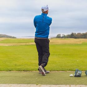 Golfer hit a golfball at Stensballegaard Golfklub in Horsens
