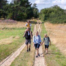 Family walking around Tunø attending The  Tunø Treasure Hunt