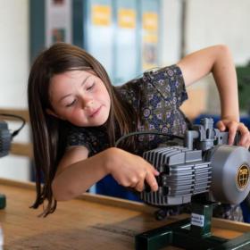 Girl playing with a engine at the Industrial Museum in Horsens