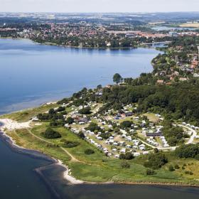 Aerial view of Husodde at Horsens Fjord with Husodde beach and Horsens City Camping