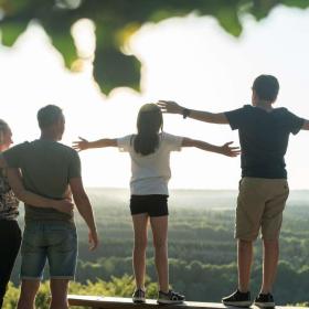 Family enjoying the view from the top of The Sugar Loaf in Destination Coastal Land