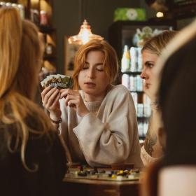 Adult females plays cards at the Board Games Café in Horsens