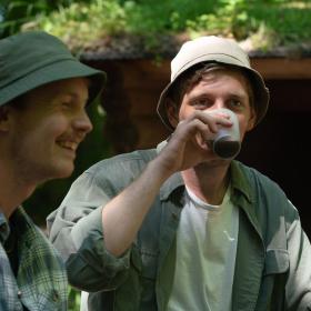 Shelter trip in Destination Coastal Land two men with bucket hats