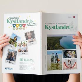 Woman is reading a brochure about the holiday destination Kystlandet