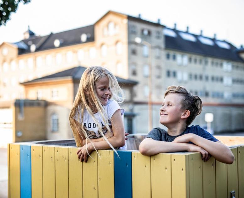 Siblings playing in a playground