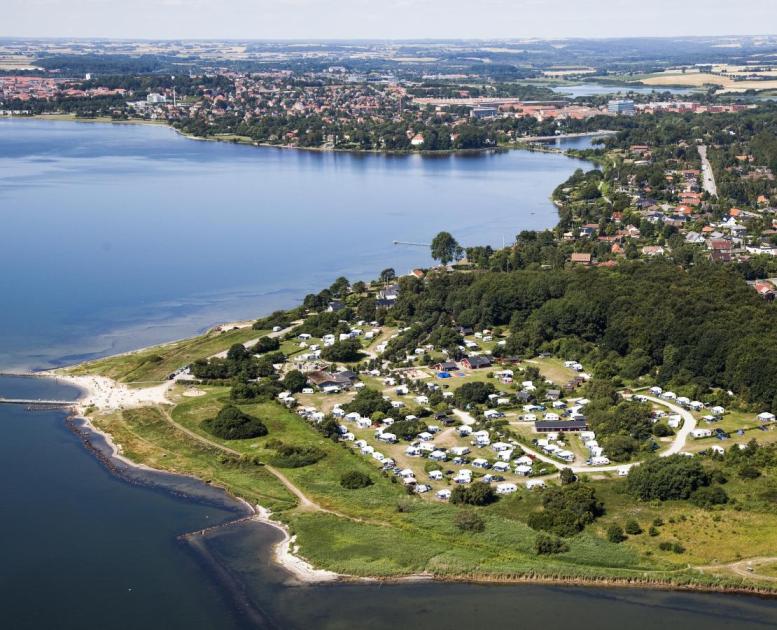 Aerial view of Husodde at Horsens Fjord with Husodde beach and Horsens City Camping